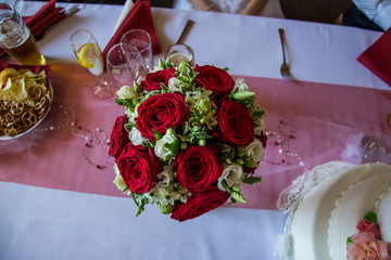 A wedding posy with red roses and white flowers - Powered by Adobe