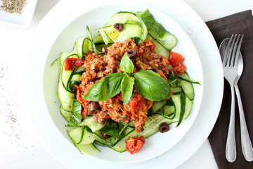 Raw Zucchini Pasta with tomato and olive sauce