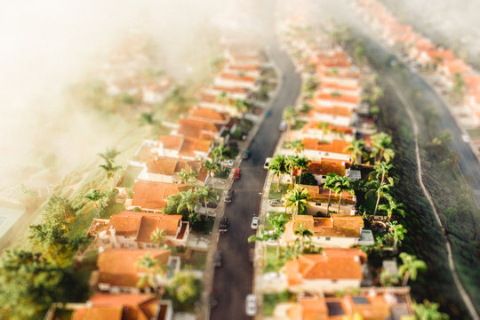Aerial view similar houses lining residential street