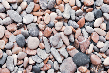 Multicolored colorful sea pebbles, natural background, texture. Close-up texture of colorful sea pebbles. Small Rock. Sea background