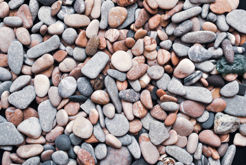 Multicolored colorful sea pebbles, natural background, texture. Close-up texture of colorful sea pebbles. Small Rock. Sea background