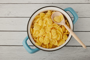 Rolled oats, healthy breakfast cereal oat flakes in bowl on wooden table