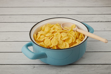 Rolled oats, healthy breakfast cereal oat flakes in bowl on wooden table