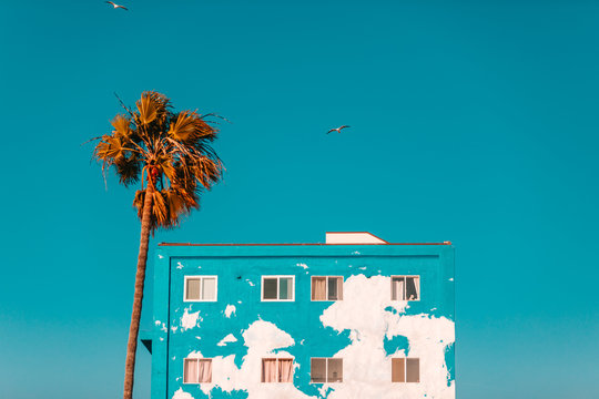 Apartment building with peeling turquoise paint