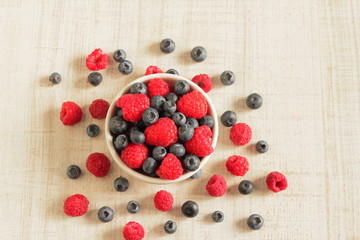 Fresh berries jam on white table, top view