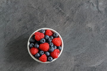 Fresh berries jam on white table, top view