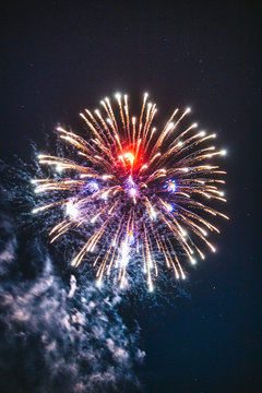 Multicolor fireworks explode in night sky