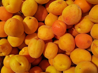 close up of ripe juicy apricots as background, top view