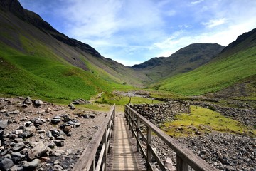 Fototapeta premium Footbridge to the mountains