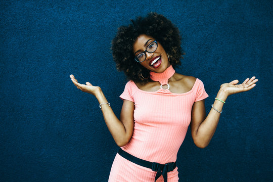 Smiling Woman Poses With Palms Up