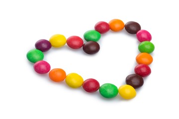 Fototapeta na wymiar Heart Made of Colorful Chocolate Coated Candies