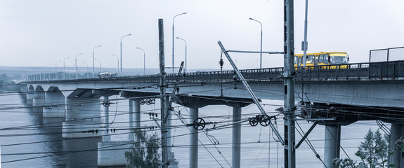 bridge over a wide river and railway wire