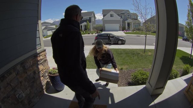 Homeowner catching thief trying to steal package from front stoop / Lehi, Utah, United States