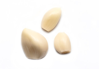 Top View of peeled Garlic isolated on white Background
