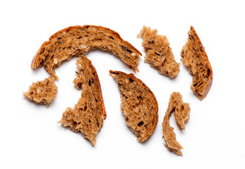 Top view of crumbled multi Grain brown Bread isolated on white Background	