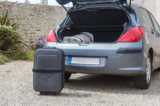 To Put The Suitcase In The Boot Of A Car Before Traveling