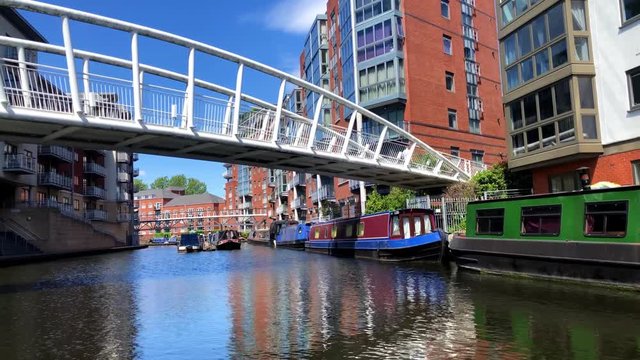 Driving on a narrowboat through the canals of Birmingham, United Kingdom