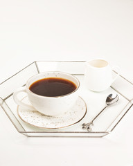 A cup of Hot art Latte Coffee on white table in Coffee shop. Sweet drink with milk