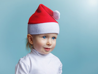 Baby in Santa Claus hat New Year Christmas 2020