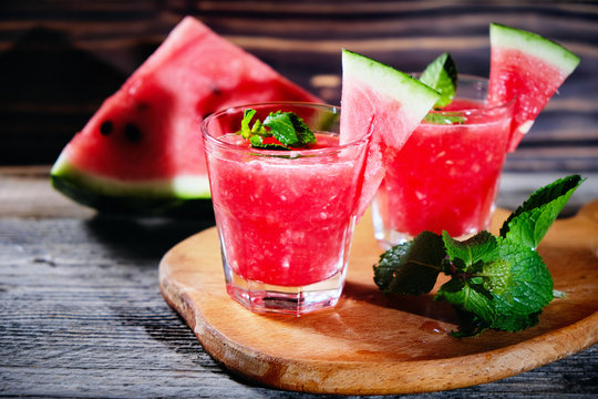 Watermelon Mojito With Watermelon Garnish On Wooden Table