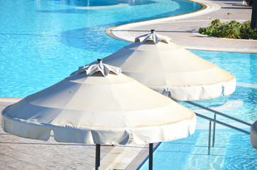 Sun umbrellas in the pool area. Rhodes, Greece
