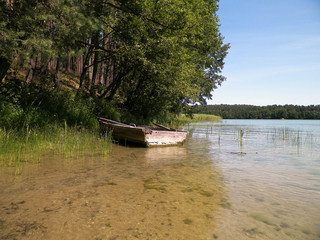 Boat on Wdzydzkie lake coast.
