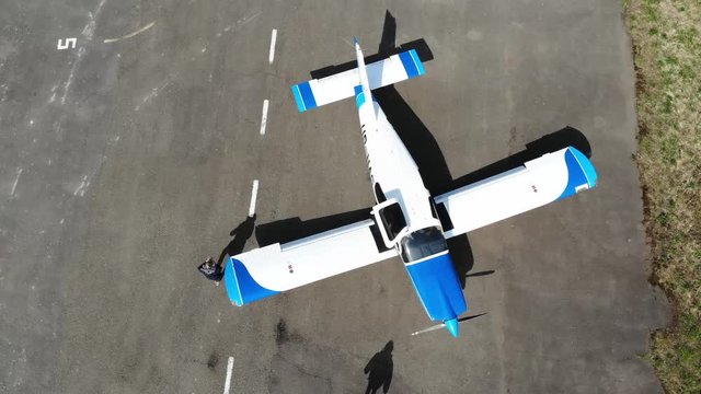 Pilot getting out from the flught, view from the top.