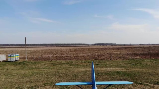 Fly over the plne, with a good view in front.