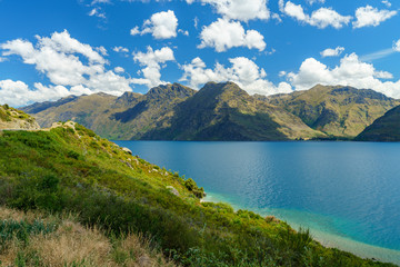 Fototapeta na wymiar mountains at lake wakatipu on a sunny day, otago, southern alps, new zealand 15