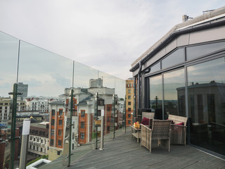 Sky cafe on the roof terrace with view of modern city