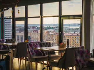 Sky cafe on the roof terrace with view of modern city