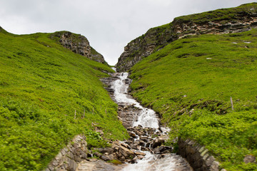 High mountains waterfall at Grossglockner High Alpine Road, Austria