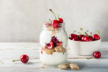 Healthy breakfast in the Jar. Bitesize shredded wheat with fresh cherry berries