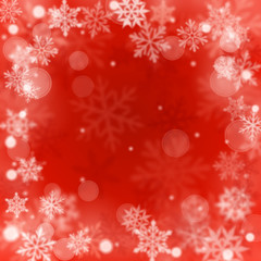 Fototapeta na wymiar Christmas blurred background of complex defocused big and small falling snowflakes in red colors with bokeh effect