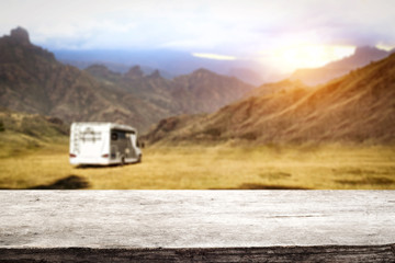 Table background in the beautiful sunset mountains view in distance