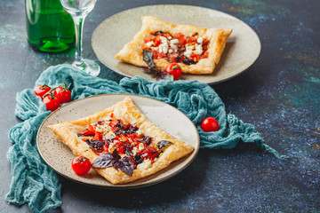 Tomato tarts with addition of aromatic herbs