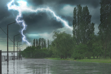 Empty city embankment under heavy rain with lightnings. Thunderstorm