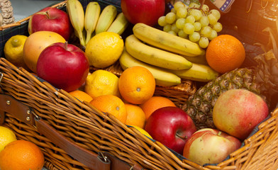 Picnic basket with different fruits
