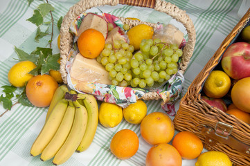 Picnic basket with different fruits