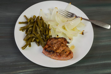 Boneless Pork Rib with Sweet Pickled Green Beans and Slice of Baked Onion Blossom