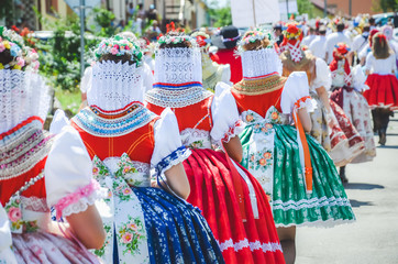Young women during parade in traditional Czech folklore costumes. Photographed in Southern Moravia,...