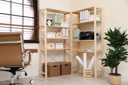 Modern home workplace with wooden storage. Idea for interior design