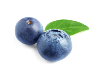 Fresh raw tasty blueberries with leaf isolated on white