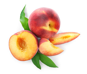 Sweet juicy peaches with leaves on white background, top view