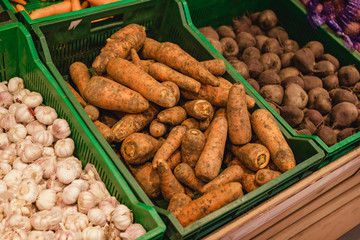 Assortment of vegetables at supermarket. shelves with variety vitamin products in fruit and vegetables department in the supermarket
