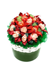 A bouquet of red flowers in a green pot