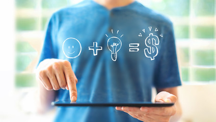 Good idea equals money with young man using a tablet computer