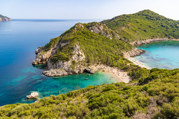 Fototapeta na wymiar Famous two side Porto Timoni beach near Agios Georgios. Crystal clear azure water. Corfu, Greece