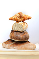 Freshly baked hommade organic bread in rustic setting. Bakery. Close-up on traditional bread.