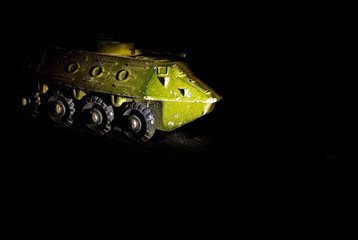 Old green metal children toys in a ray of light. Soviet toys. Military equipment. - 279033070